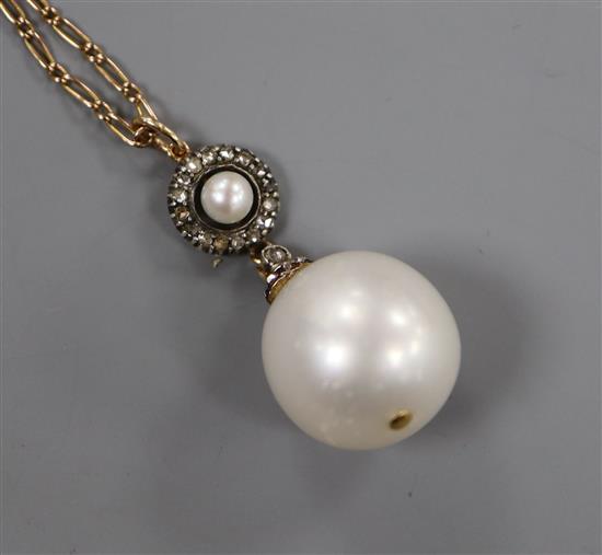 A yellow metal, rose cut diamond and cultured pearl set drop pendant, on a yellow metal chain, pendant approx. 28mm.
